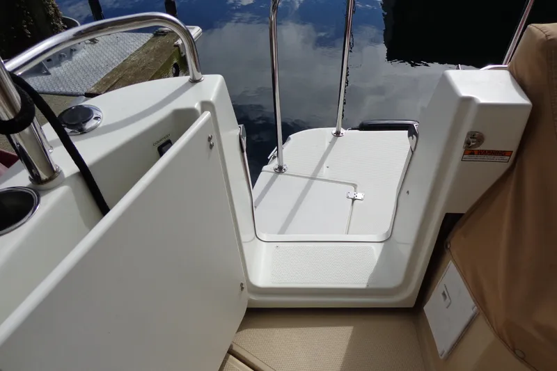 Slide: The Image of 2016 Ranger Tugs R-31 S boat deck with open gate and railing. - 10