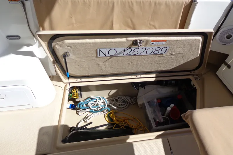 Slide: The Image of Storage compartment of 2016 Ranger Tugs R-31 S boat with ropes and equipment. - 53