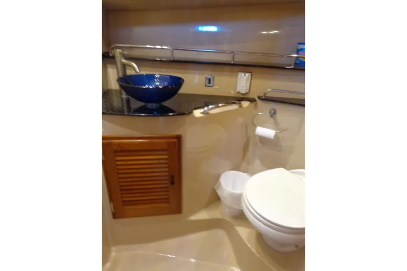 Slide: The Image of 2016 Ranger Tugs R-31 S bathroom with blue vessel sink and modern fixtures. - 26