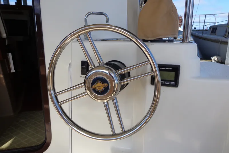 Slide: The Image of Steering wheel of 2016 Ranger Tugs R-31 S boat with Volvo Penta controls. - 54