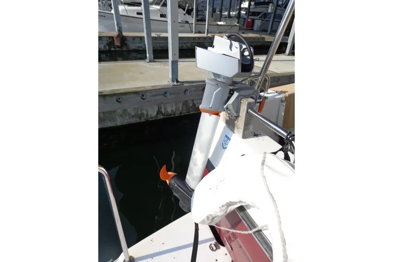 Slide: The Image of 2016 Ranger Tugs R-31 S docked, showcasing a mounted outboard motor. - 55