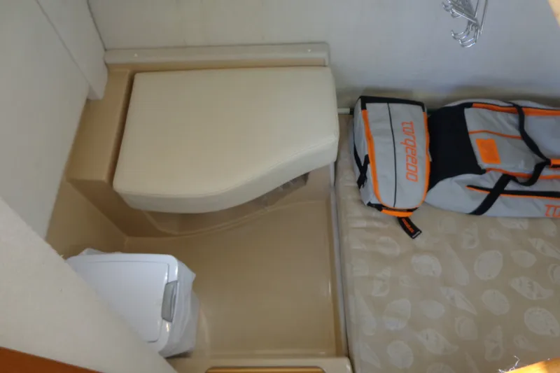 Slide: The Image of 2016 Ranger Tugs R-31 S interior with compact toilet and storage bag. - 32