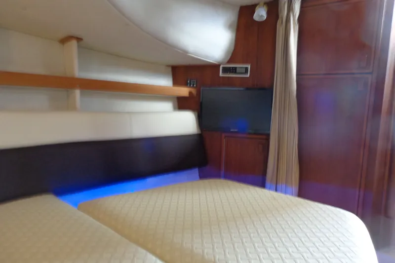 Slide: The Image of Interior cabin of 2016 Ranger Tugs R-31 S with TV and cozy seating. - 29