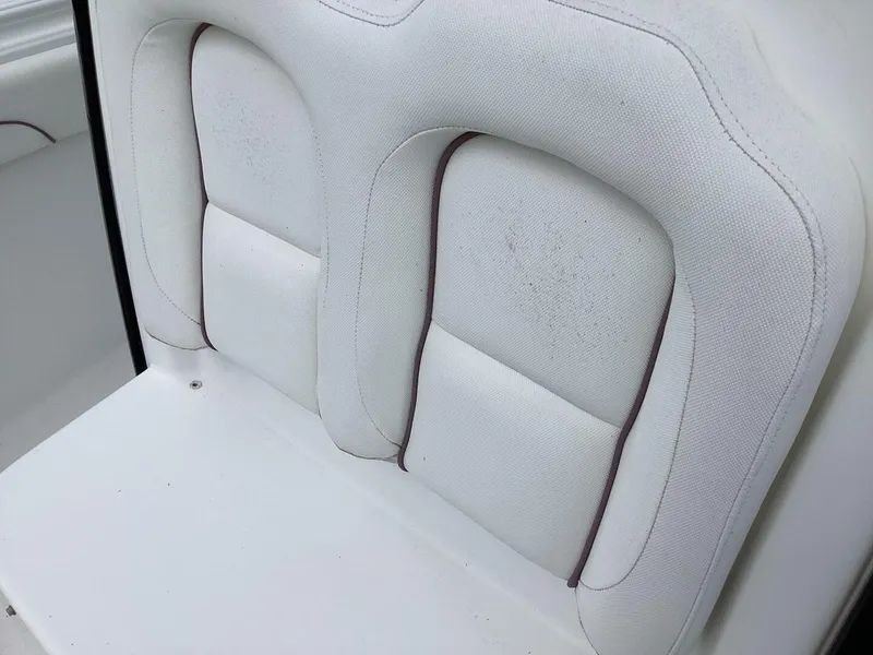 Slide: The Image of White upholstered seat with elegant stitching on a boat. - 20