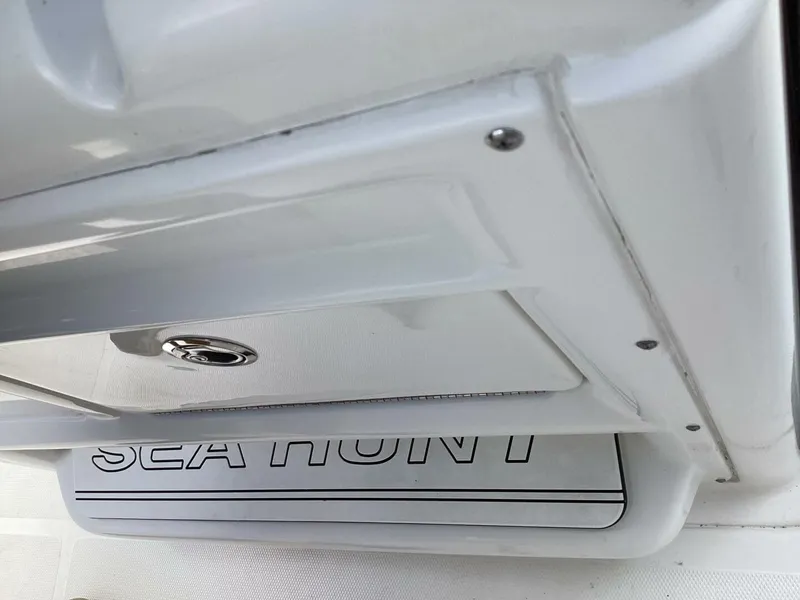 Slide: The Image of Close-up of a white boat part with "Sea Hunt" lettering. - 40