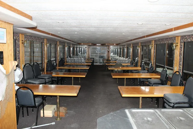 Slide: The Image of Interior of a 2000 Sumerset 75 Houston with long tables and chairs. - 43