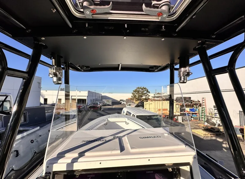 Slide: The Image of The image shows the cockpit of a 2006 Albin 26 Center Console boat with a clear forward view. - 8
