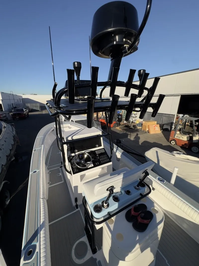 Slide: The Image of The image shows a 2006 Albin 26 Center Console boat with a spacious deck and modern equipment. - 11