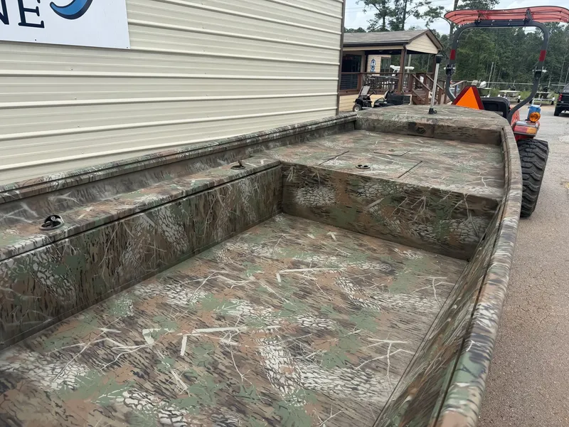Slide: The Image of The image shows a G3 Gator Tough 15DK-25HP boat with a camouflage pattern. - 3