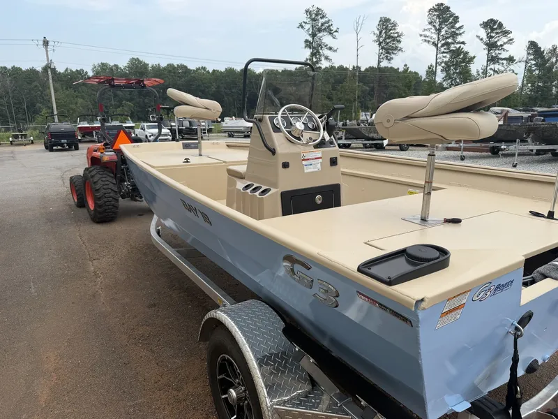 Slide: The Image of A 2026 G3 Bay 18 BAY-90SHO boat on a trailer, featuring a console and seating. - 7