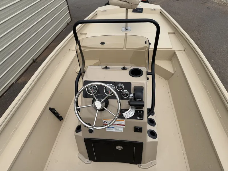 Slide: The Image of The image shows the cockpit of a 2026 G3 Bay 18 BAY-90SHO boat with a helm and instruments. - 5