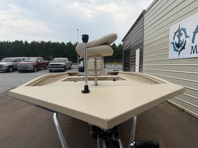 Slide: The Image of A 2026 G3 Bay 18 BAY-90SHO boat on a trailer beside a building. - 2