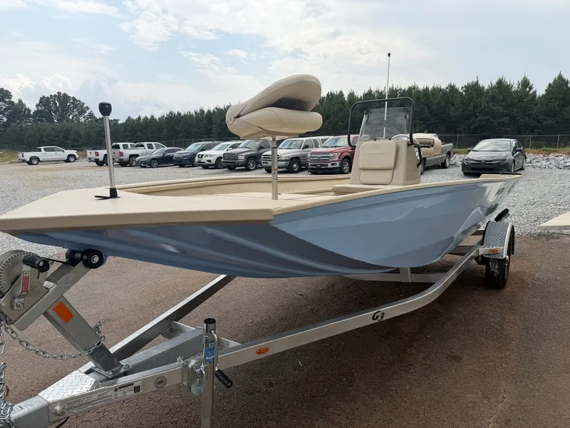 Slide: The Image of A 2026 G3 Bay 18 BAY-90SHO boat on a trailer, surrounded by cars and trees. - 3