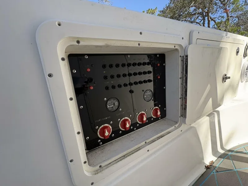 Slide: The Image of An open control panel with switches and gauges on a boat. - 41