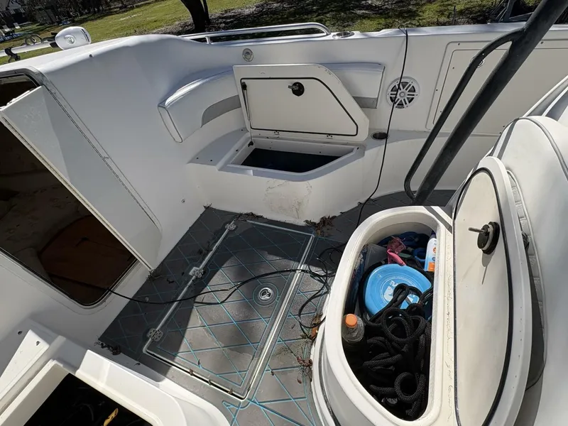 Slide: The Image of The image shows the cockpit of a 2008 Wellcraft 35 Scarab Sport with storage and seating. - 36
