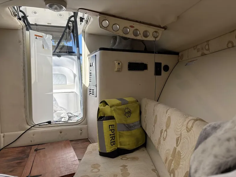 Slide: The Image of Interior of a 2008 Wellcraft 35 Scarab Sport with seating and an EPIRB bag. - 31