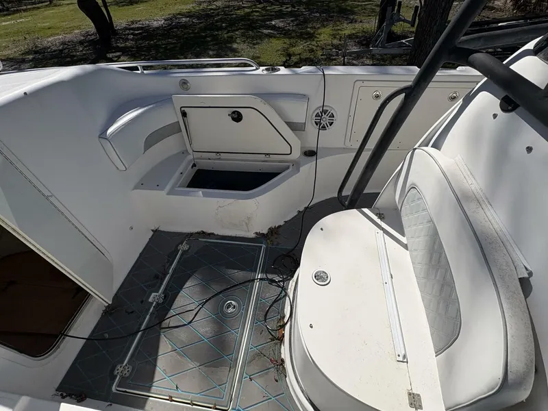 Slide: The Image of The image shows the cockpit of a 2008 Wellcraft 35 Scarab Sport with white upholstery. - 37