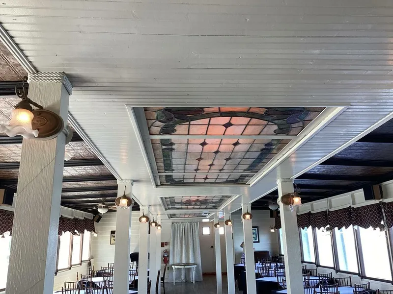 Slide: The Image of An elegant interior with a decorative ceiling and chandeliers, surrounded by windows with curtains. - 27