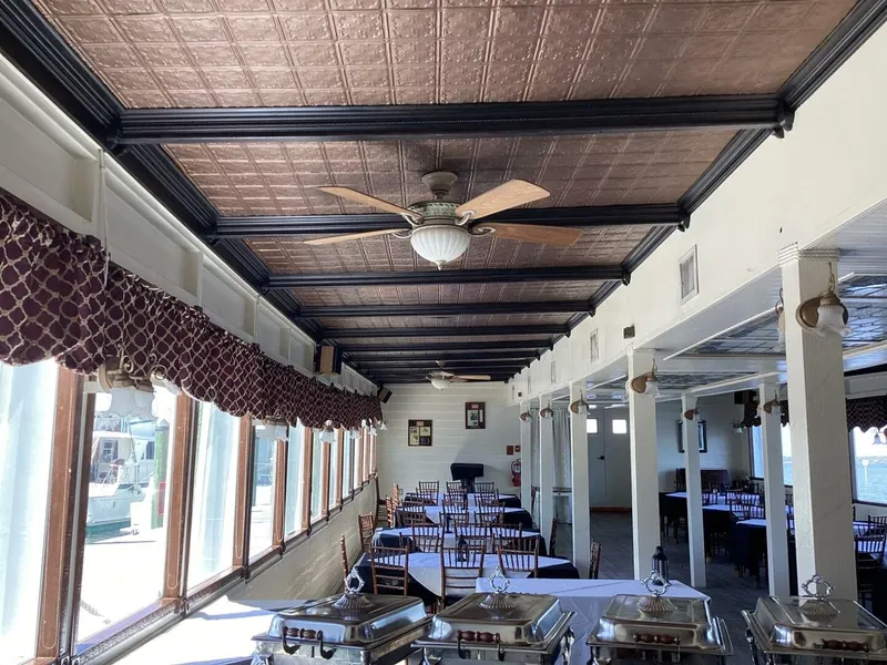 Slide: The Image of Interior of a boat with set tables and decorative ceiling. - 21