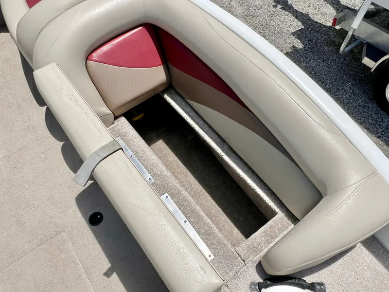 Slide: The Image of The image shows a beige and red seat with an open storage compartment underneath. - 30