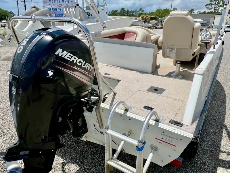 Slide: The Image of The image shows a 2016 Lowe Sport Deck 224 boat with a Mercury outboard motor. - 10
