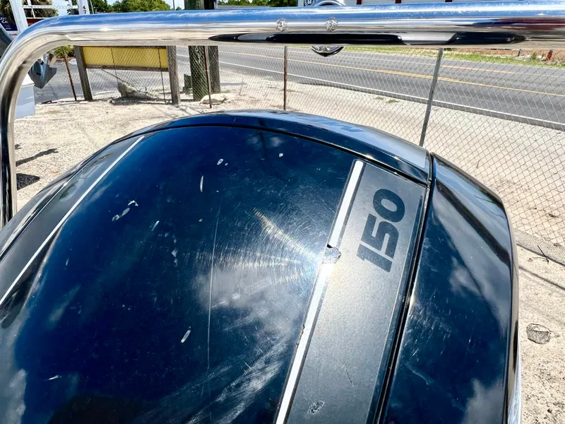 Slide: The Image of An outboard motor labeled "150" is attached to a boat. - 45