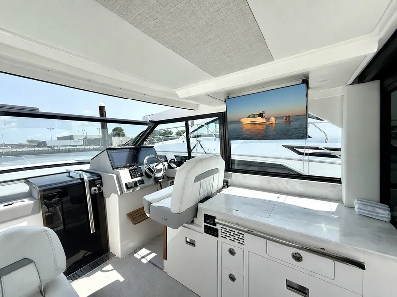 Slide: The Image of Interior view of a modern yacht with sleek helm console and comfortable seating. - 19