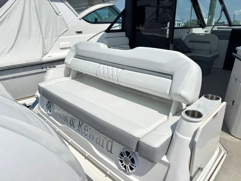 Slide: The Image of The 2023 Regal 36 XO features a luxurious white bench seat with integrated speakers. - 10