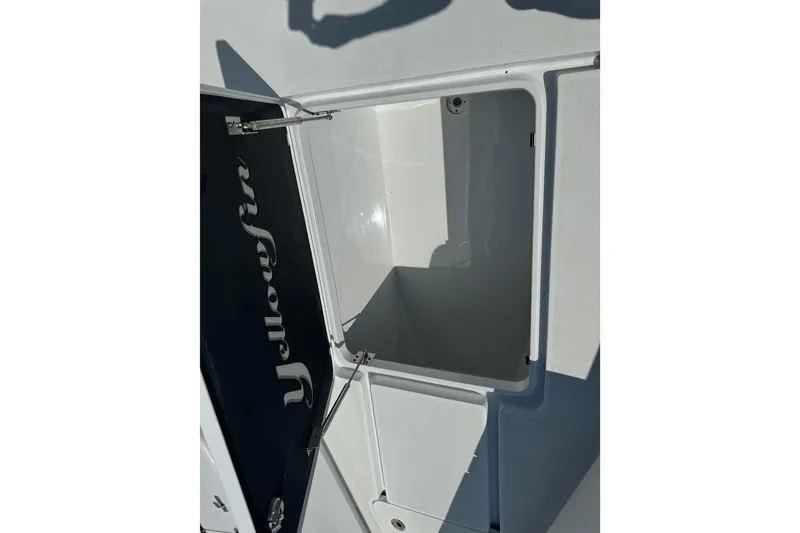 Slide: The Image of 2024 Yellowfin 39 Offshore boat storage compartment with open hatch. - 8