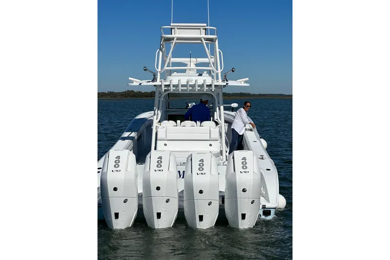 Slide: The Image of 2024 Yellowfin 39 Offshore boat with quad 400 V10 engines on the water. - 1