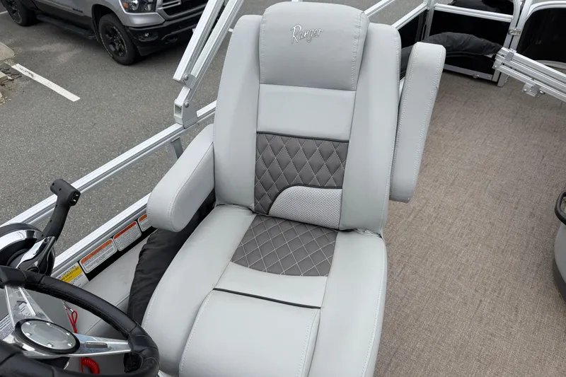 Slide: The Image of 2021 Ranger Reata 223FC boat seat with gray upholstery and diamond stitching. - 9