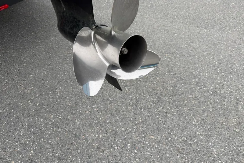 Slide: The Image of Close-up of a 2021 Ranger Reata 223FC boat propeller on asphalt surface. - 5