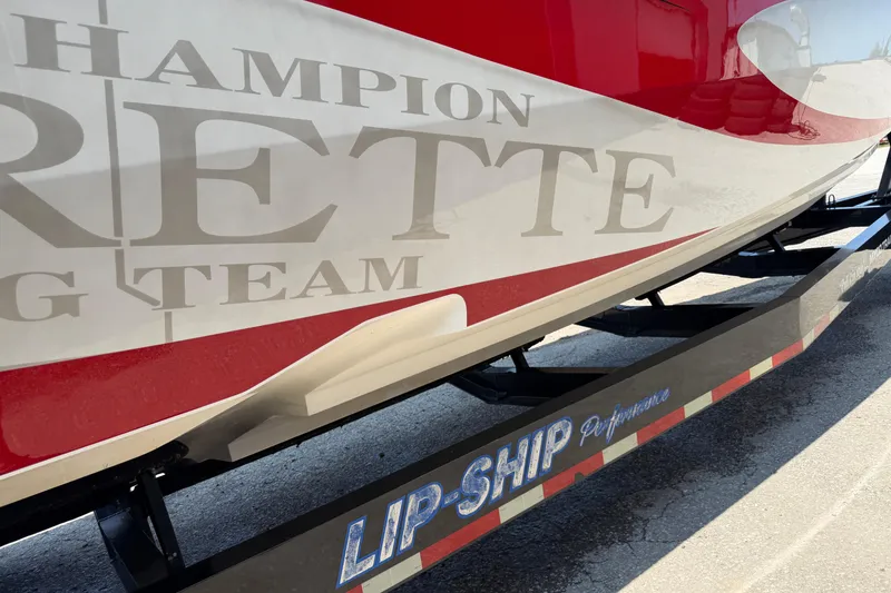 Slide: The Image of 2003 Cigarette 36' Gladiator boat on Lip-Ship Performance trailer, featuring bold graphics. - 18