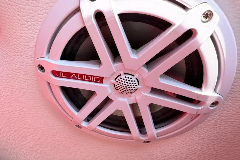 Slide: The Image of JL Audio speaker on 2003 Cigarette 36' Gladiator boat, featuring a sleek white grille design. - 24