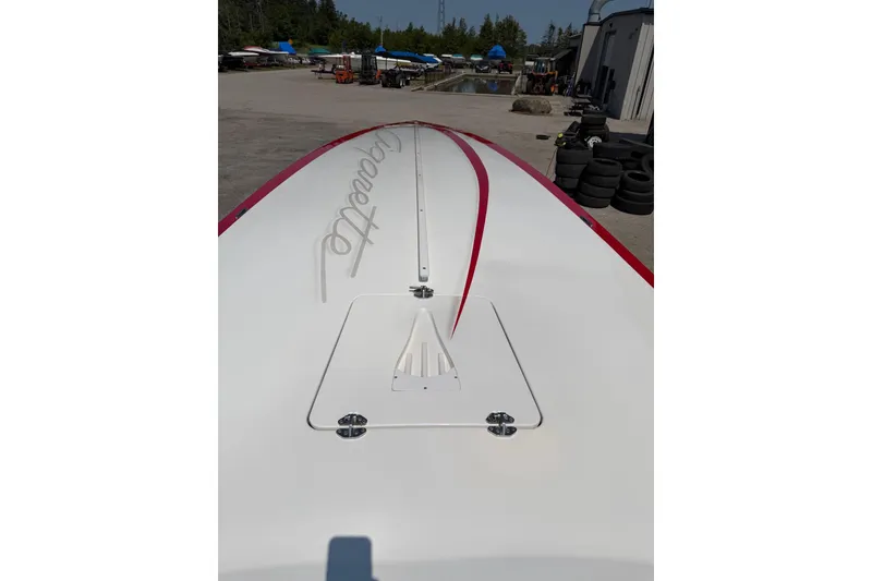 Slide: The Image of 2003 Cigarette 36' Gladiator boat deck with red accents in a marina setting. - 26
