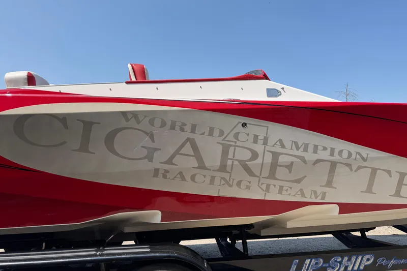 Slide: The Image of 2003 Cigarette 36' Gladiator boat with "World Champion" racing team logo, red and white design. - 19
