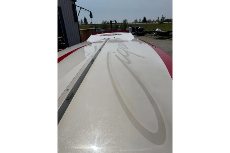Slide: The Image of 2003 Cigarette 36' Gladiator boat with sleek design and red accents. - 20