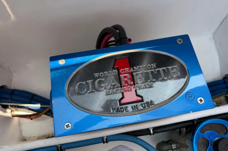 Slide: The Image of Blue engine component of 2003 Cigarette 36' Gladiator, featuring "World Champion Racing Team" emblem. - 39