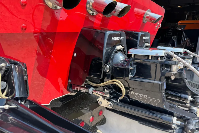 Slide: The Image of Close-up of 2003 Cigarette 36' Gladiator boat engines with Mercury Racing XR drives. - 14