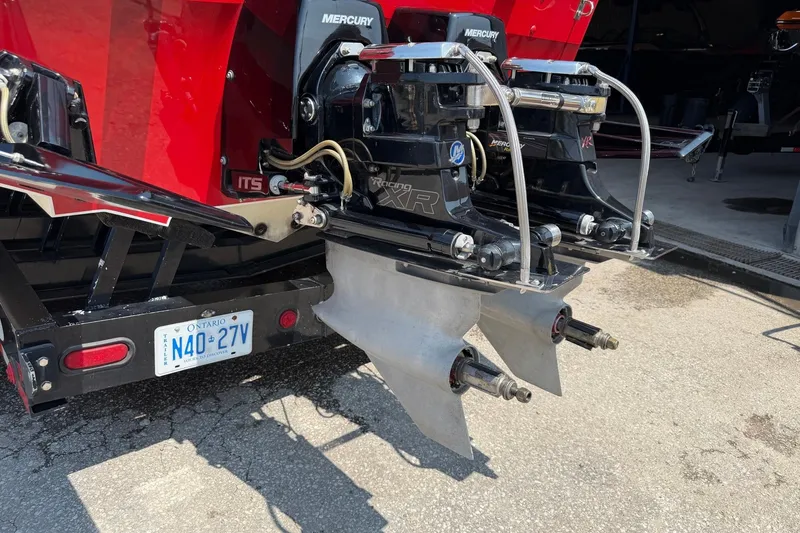 Slide: The Image of Rear view of a 2003 Cigarette 36' Gladiator boat with Mercury engines and Ontario license plate. - 10