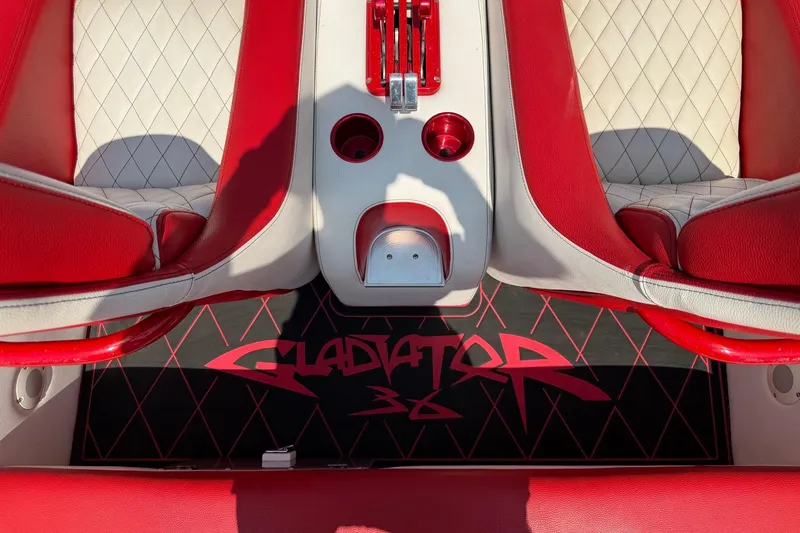 Slide: The Image of Interior of 2003 Cigarette 36' Gladiator boat with red and white seating. - 32