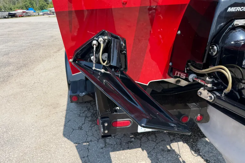 Slide: The Image of Rear view of a 2003 Cigarette 36' Gladiator boat with red and black detailing. - 13