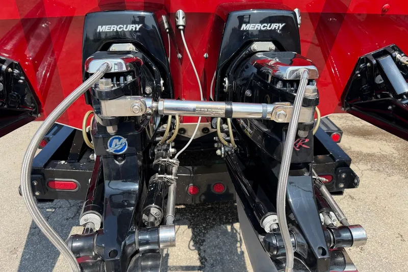 Slide: The Image of Twin Mercury engines on a 2003 Cigarette 36' Gladiator boat, showcasing powerful performance. - 12