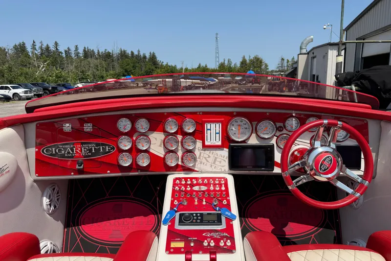 Slide: The Image of Cockpit of a 2003 Cigarette 36' Gladiator boat with red and white interior. - 30