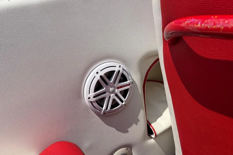 Slide: The Image of 2003 Cigarette 36' Gladiator interior with JL Audio speaker and red accents. - 31