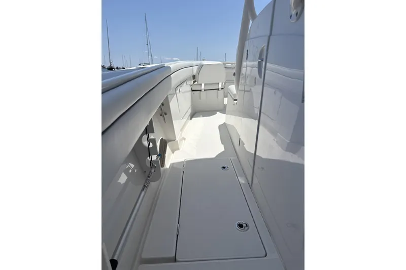 Slide: The Image of 2018 Jupiter 34 boat deck with sleek white finish and seating area. - 9