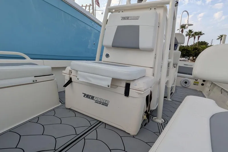 Slide: The Image of 2021 Pathfinder 2200 TRS boat interior with seating and storage, featuring a sleek design. - 10