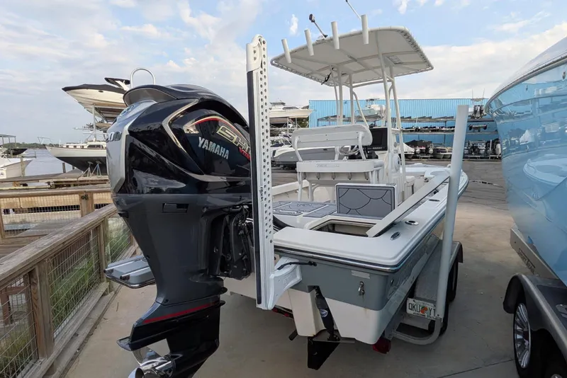 Slide: The Image of 2021 Pathfinder 2200 TRS boat with Yamaha engine at a marina. - 6