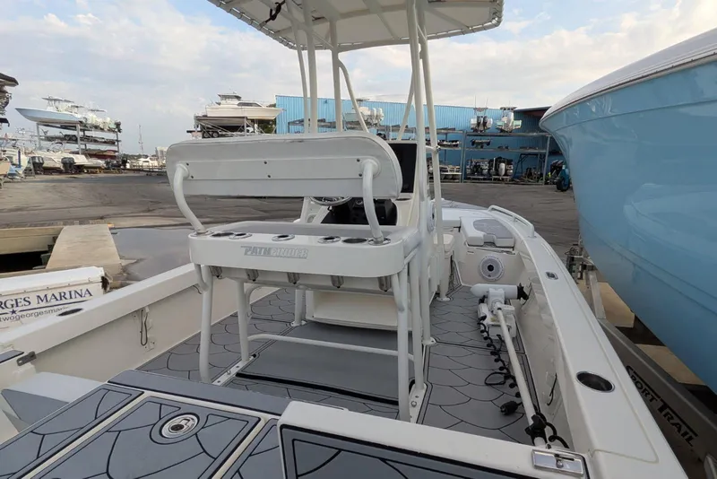 Slide: The Image of 2021 Pathfinder 2200 TRS boat at marina, featuring sleek design and modern amenities. - 11