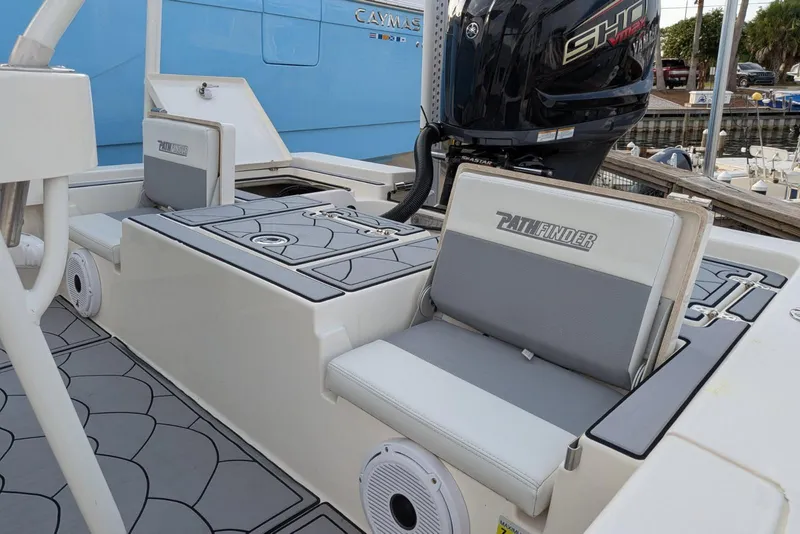 Slide: The Image of 2021 Pathfinder 2200 TRS boat interior with seating and Yamaha engine. - 14